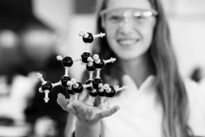 Schientist holding a C-H bond diagram