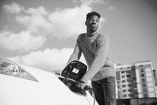 Man charging an electric car