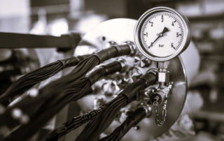 High Pressure in Chemistry blog post showing pressure gauge applied to equipment