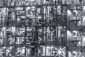 Large scale chicla plant at night for blog Improve Chemical Synthesis Figure 2