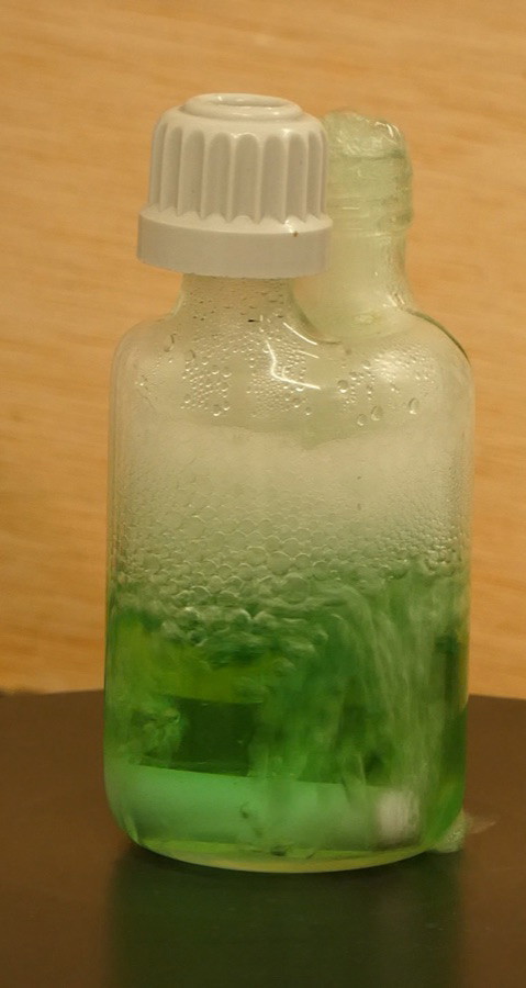 Test cell venting a foamy two-phase mixture