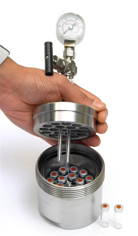 Vial insert lifted out of a CAT screening block
